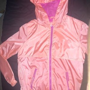 orange/salmon windbreaker.